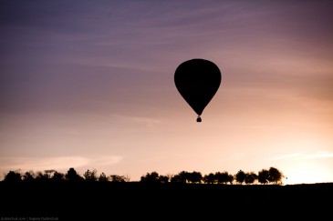 Silhouette of balloon at sunrise flying in Cappadocia