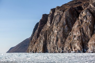 Steep shore of frozen lake Baikal