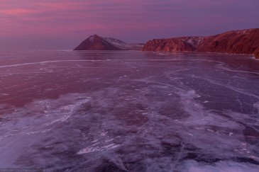 Frozen lake Baikal in winter at sunrise