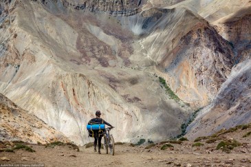 Cyclist on path of Zanskar Valley. India