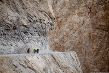 Touring cyclists on dangerous mountain road. Ladakh, Indian Himalayas