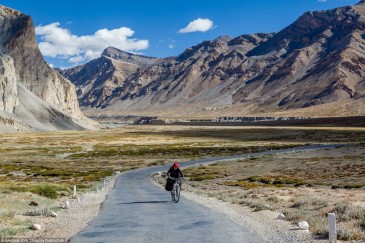 Tourist cycling in Himalayas. India