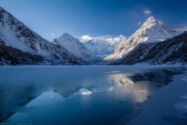 Freezing Akkem lake and Belukha mountain in the morning. Altai