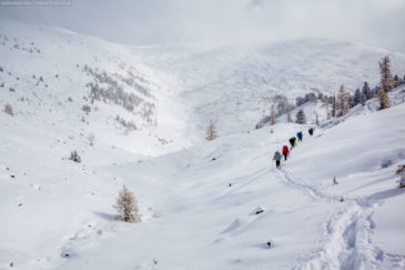 Snow-covered mountains of Altai republic and hikers
