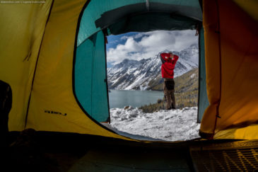 View at Kucherla lake and hiker from inside of tent. Altai mountains