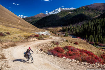 Adventurer cycling in Tibet mountains